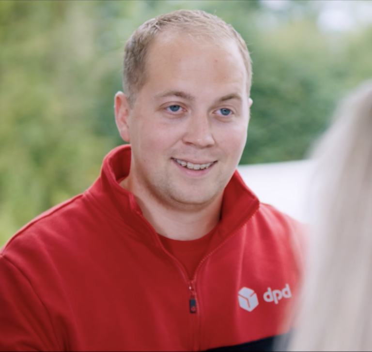 DPD Delivery driver smiling at customer